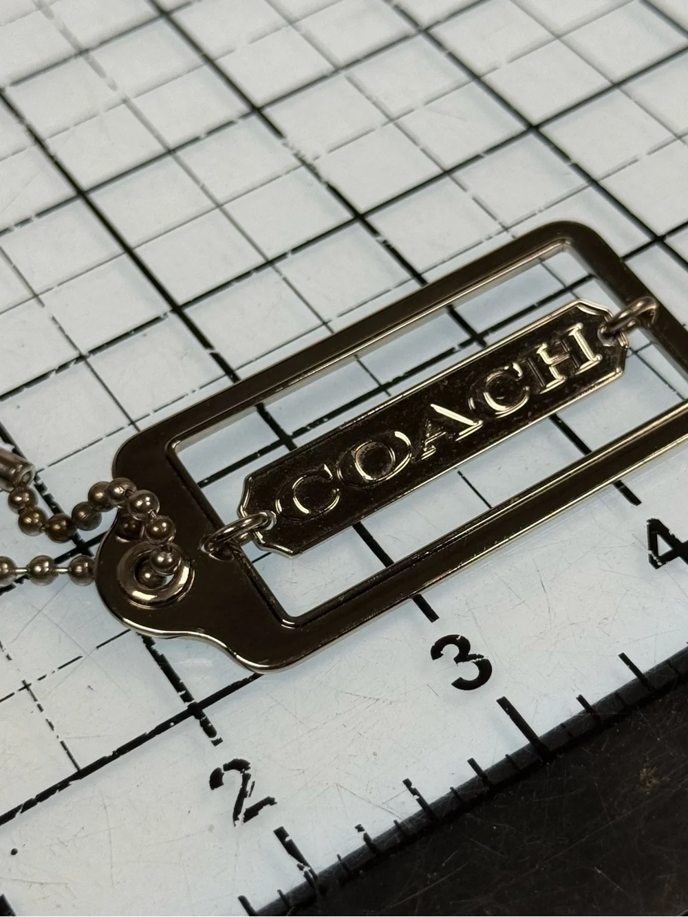 Coach gold tone